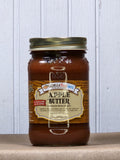 Jar of Apple Butter with no sugar added, featuring a brownish-orange spread inside a glass jar with a gold lid and a beige