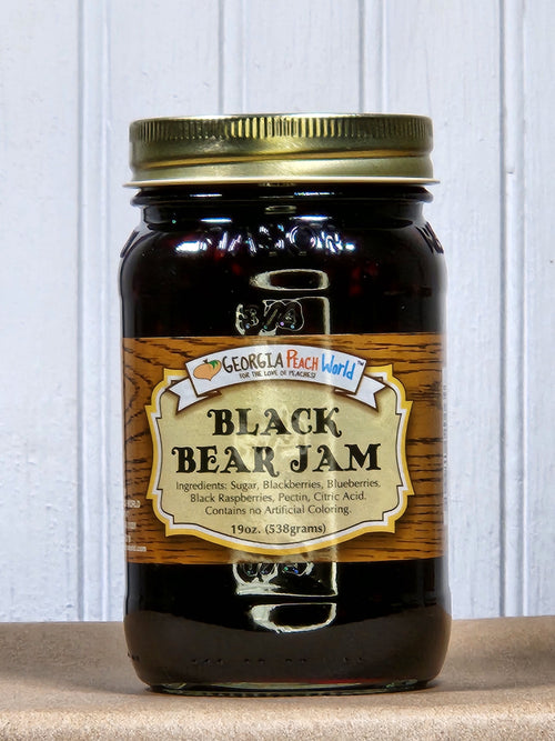 Blackberry Fruit Jam with Berry Flavors in a glass jar with a gold lid, featuring a label with product name and ingredients