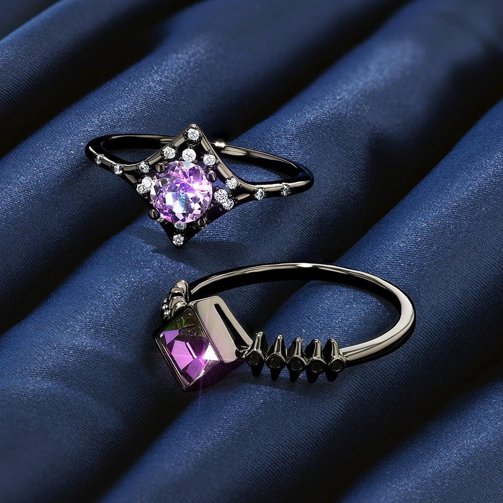 Wicked Witch of the West Jewel Candle rings with purple and pink gemstones, set on dark blue satin fabric.