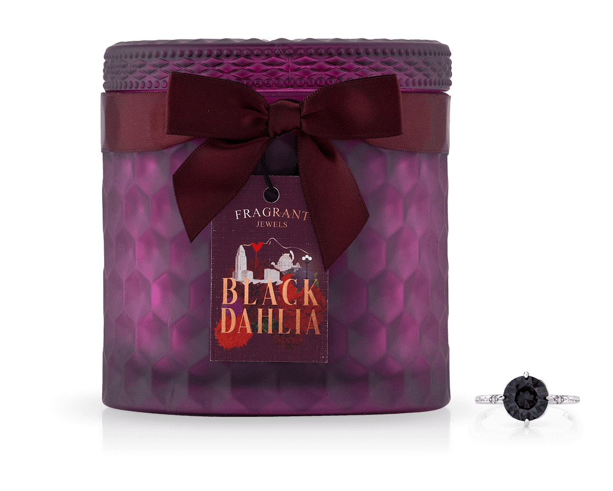 Black Dahlia Satin Collection Jewel Candle with a dark red ribbon bow and a black gemstone ring beside it.