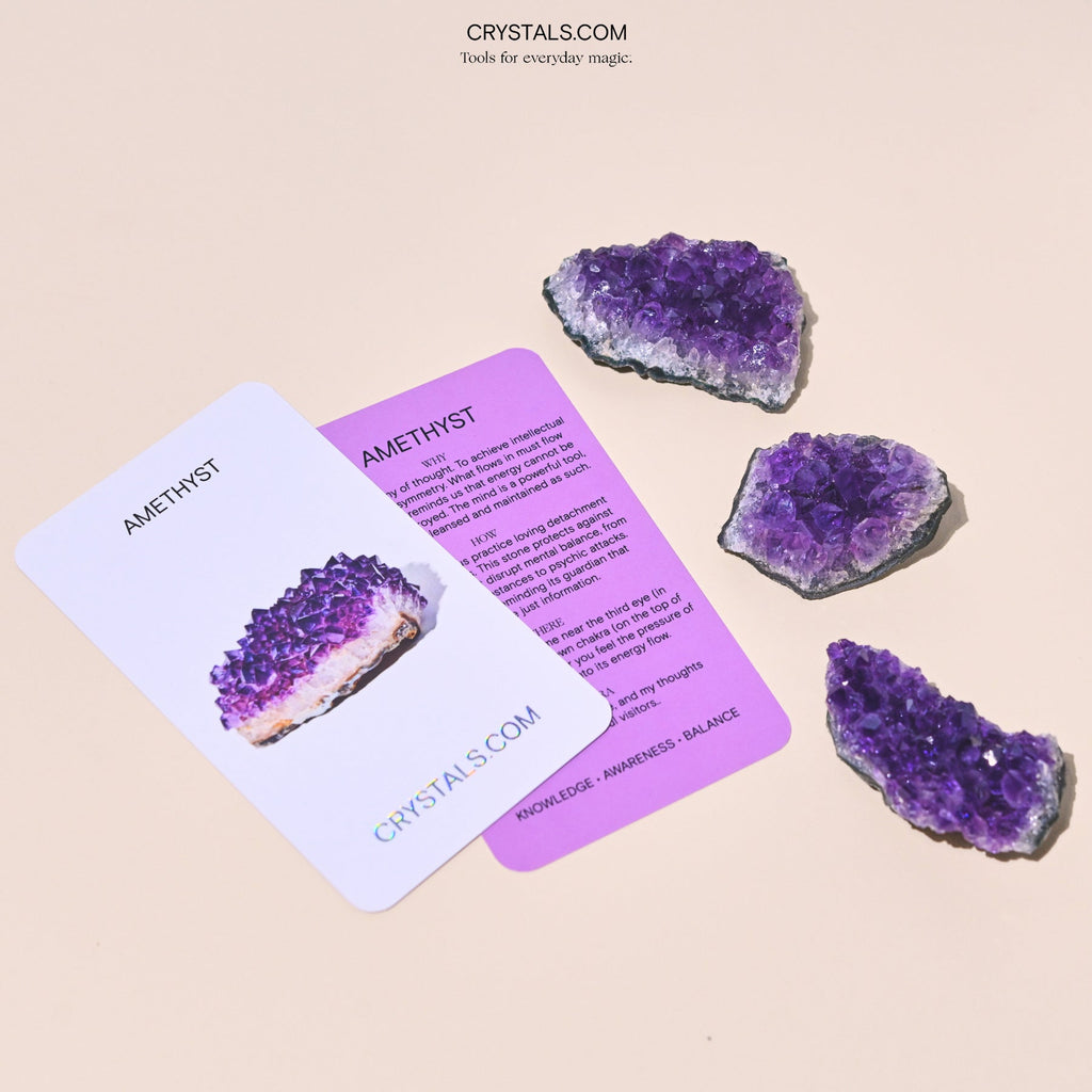 Amethyst Cluster with purple crystalline formations on a dark base, used for decoration or energy healing.