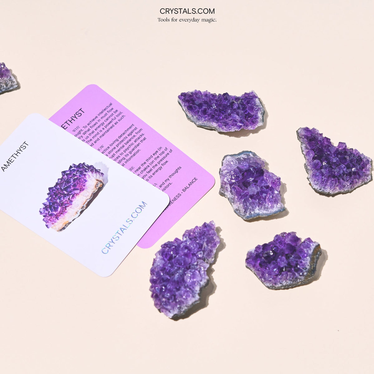 Amethyst Cluster with purple crystalline formations on a gray base, displayed alongside informational cards.