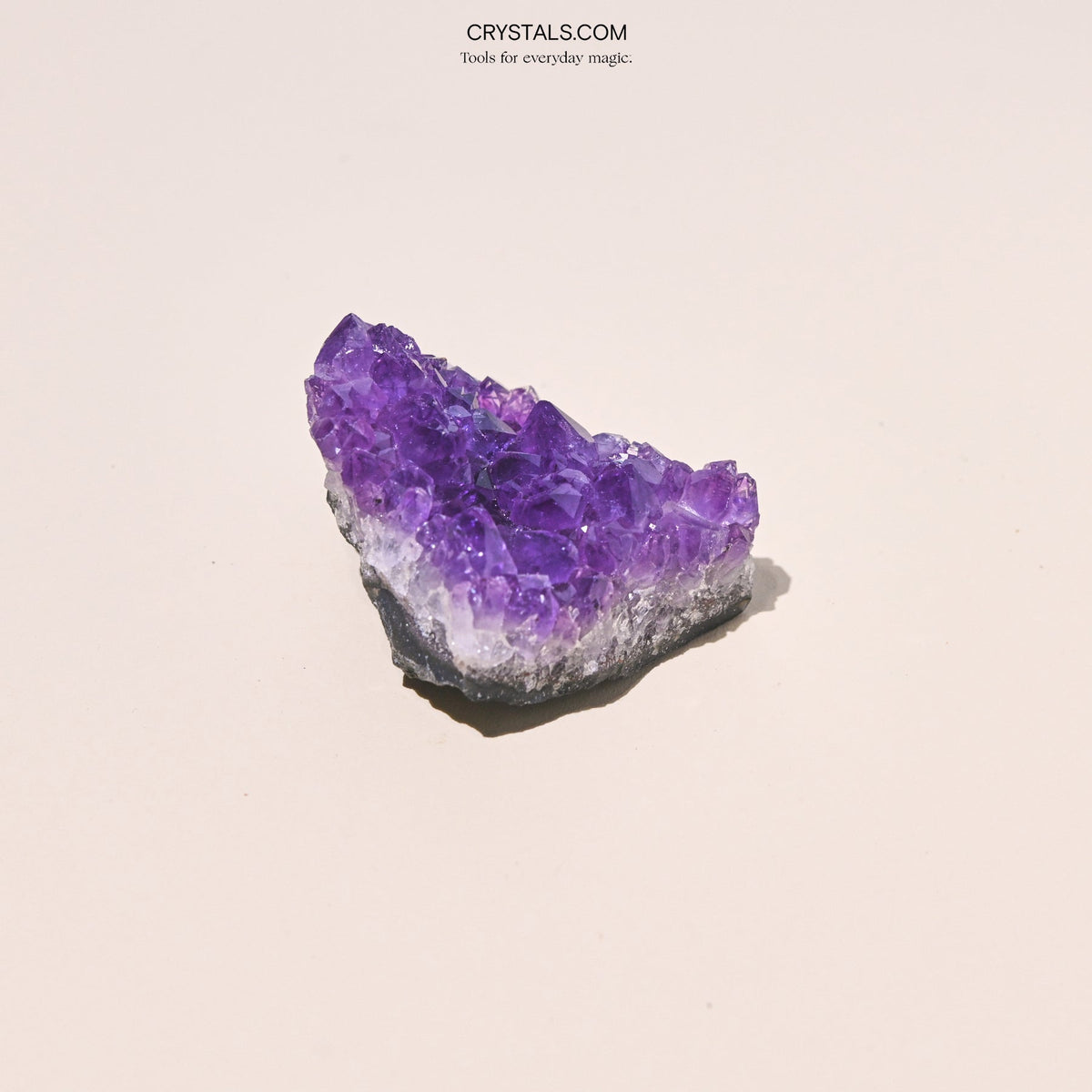 Amethyst Cluster with purple crystalline formations on a gray base.