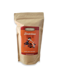 Bag of Tenacious Brew coffee beans in a beige resealable pouch with an orange label featuring a dancing woman illustration
