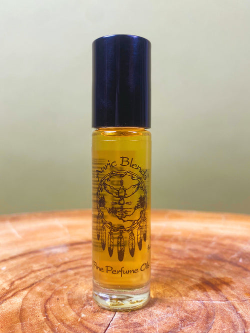 Fire Goddess Roll-on Perfume Oil in a clear glass roll-on bottle with a black cap, featuring a yellow label with a