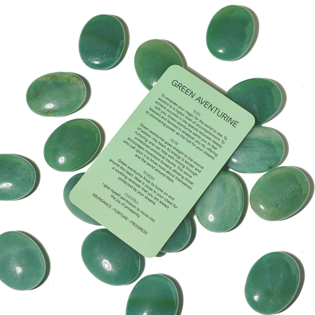 Green Aventurine Palm Stone with smooth, polished green stone and a partially visible product tag.