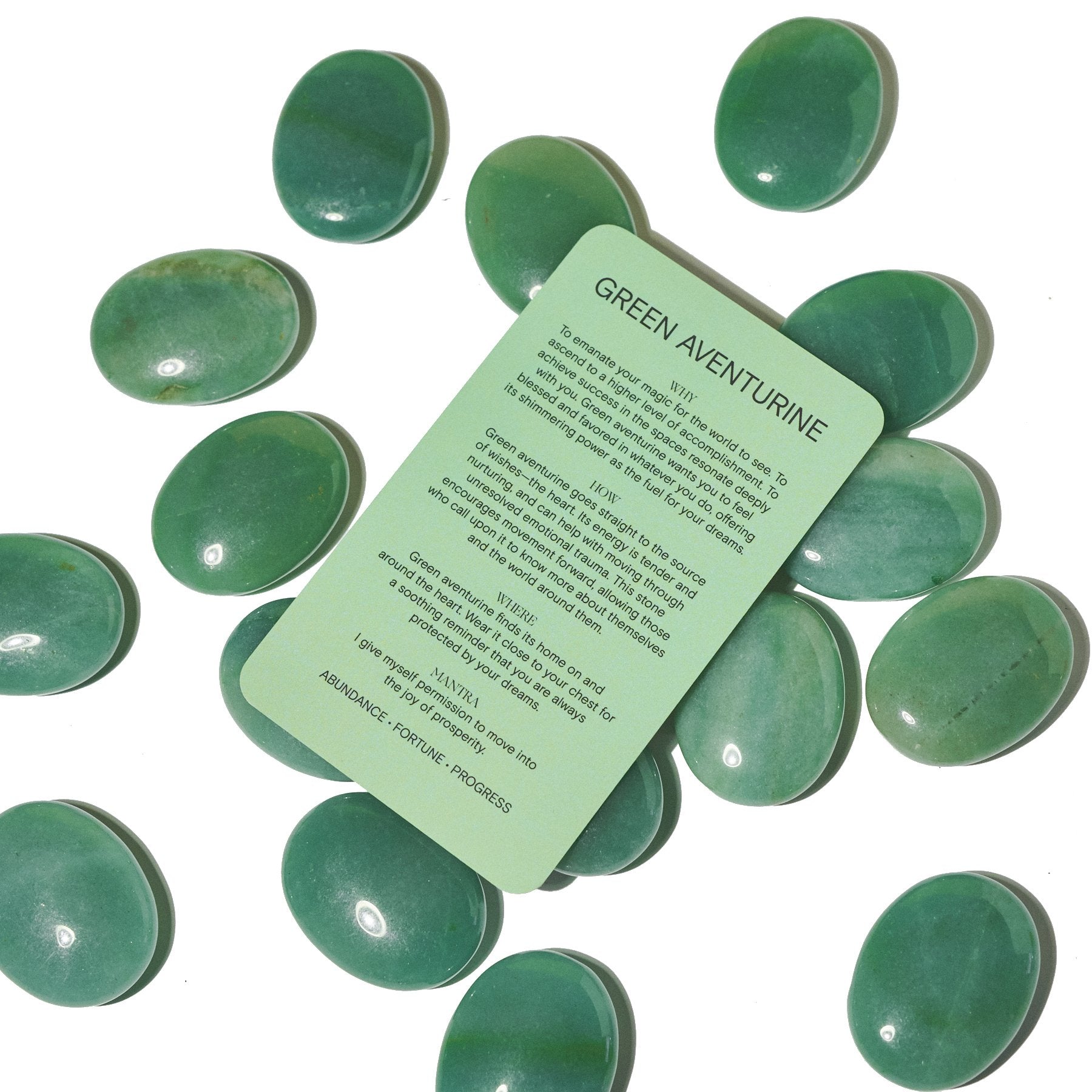 Green Aventurine Palm Stone with smooth, polished green stone and a partially visible product tag.