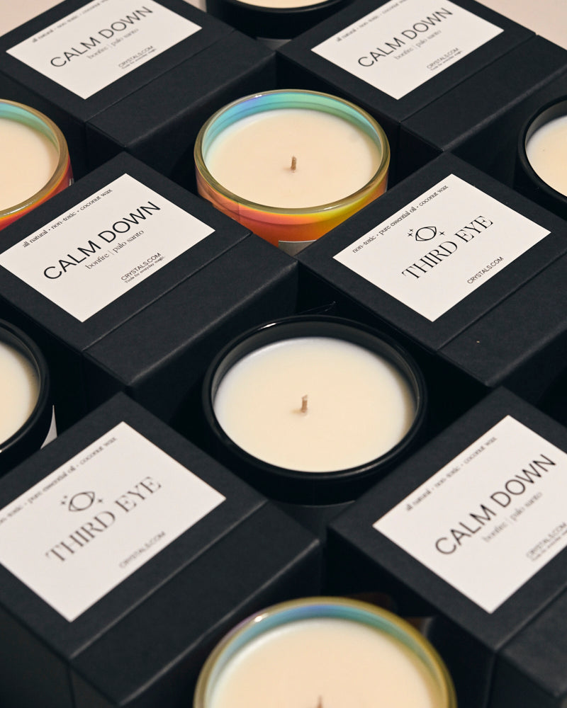 Third Eye Candle in colorful glass container with white wax, surrounded by black boxes labeled Calm Down.