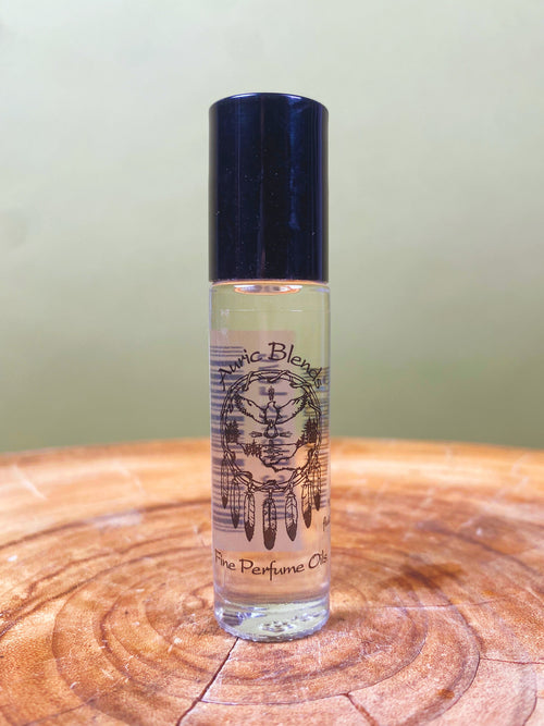 Love Roll-on Perfume Oil in a clear glass bottle with a black cap, featuring a black and white dreamcatcher design on the
