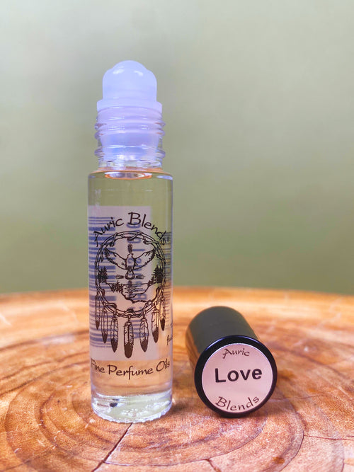 Love Roll-on Perfume Oil in a clear glass bottle with a black cap, featuring a black and white dreamcatcher illustration and