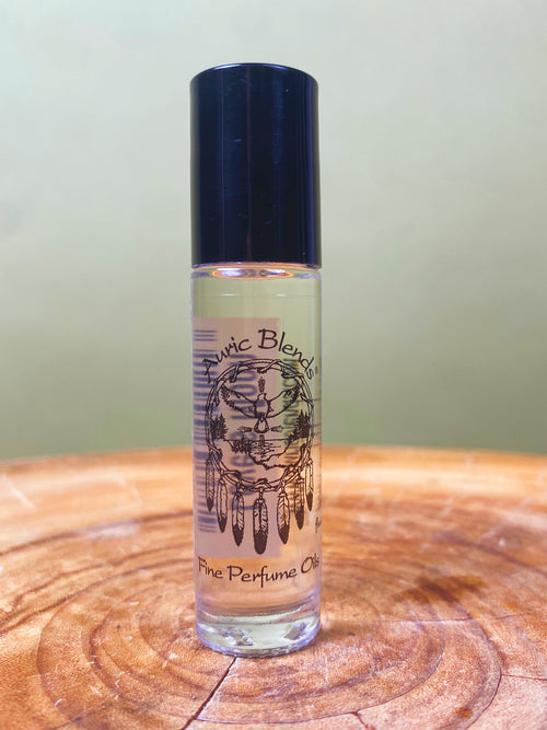 Lovers Moon Roll-on Perfume Oil in a clear glass bottle with a black cap, featuring a dreamcatcher graphic and labeled as